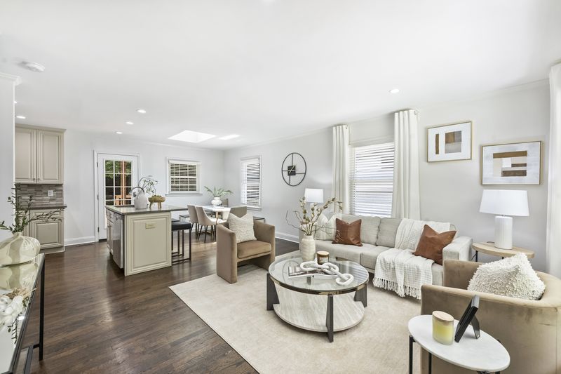 The open main level, living room through to the kitchen and dining under a skylight