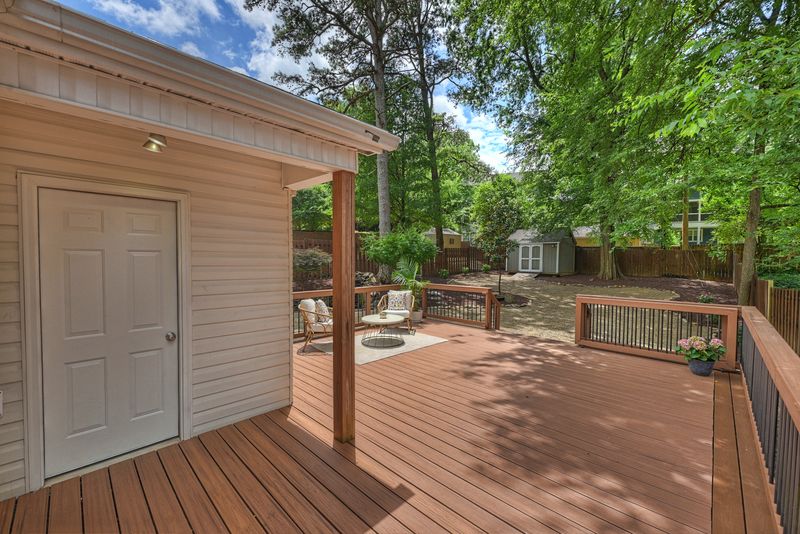 The deck at the back of the house, looking over the yard