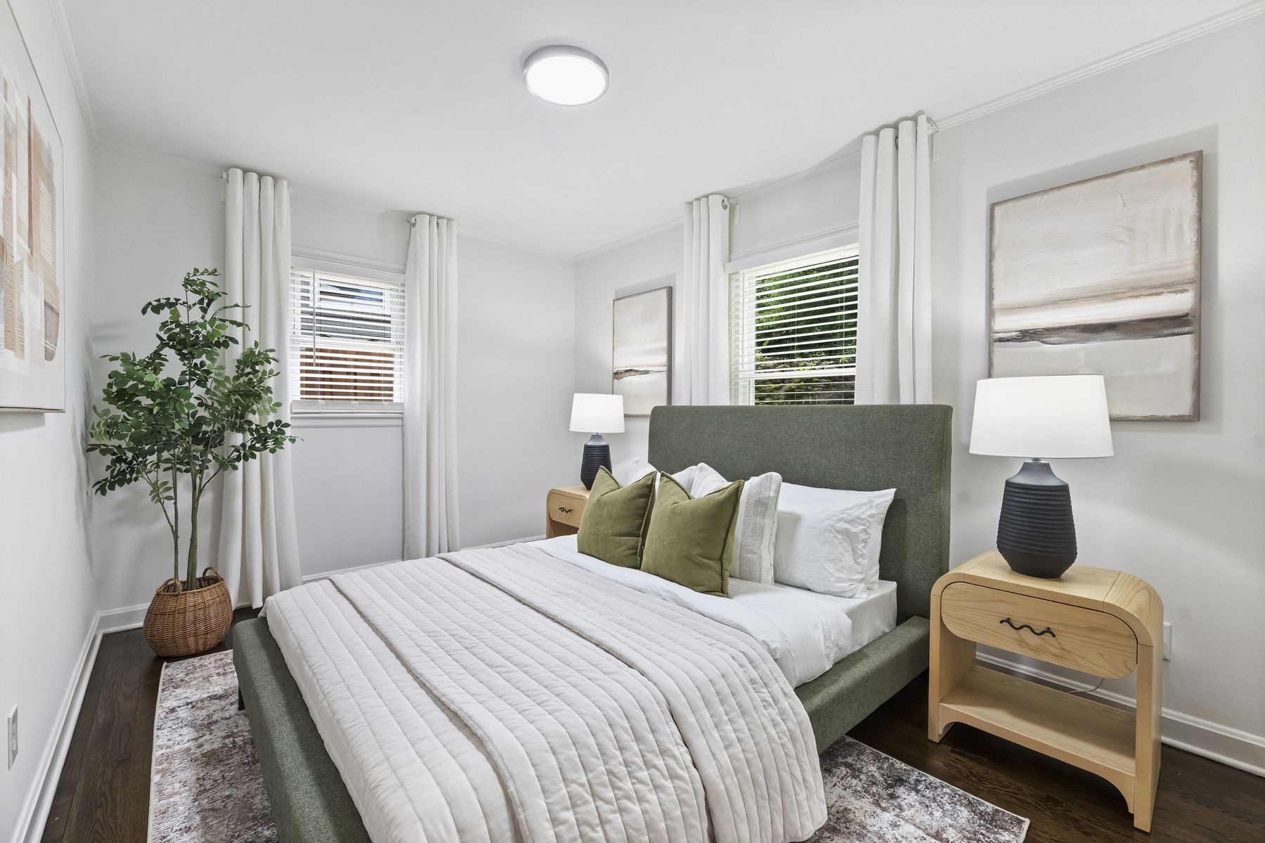 Bedroom with hardwood floors and natural light
